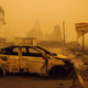 A charred vehicle is seen in the parking lot of the burned Oak Park Motel after the passage of the Santiam Fire in Gates, Oregon, on September 10, 2020.